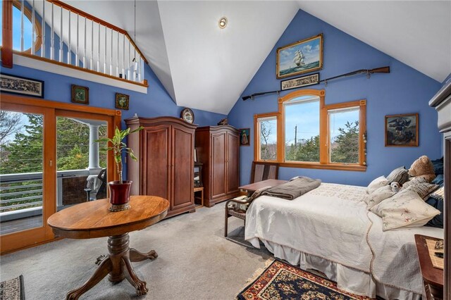 bedroom featuring high vaulted ceiling, light carpet, and access to outside