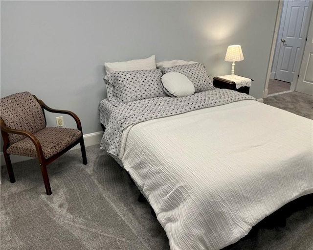 bedroom featuring baseboards and carpet flooring