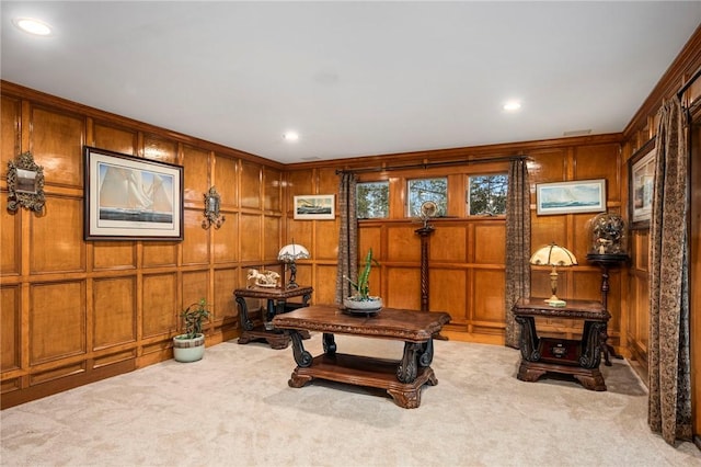 living area featuring carpet and recessed lighting