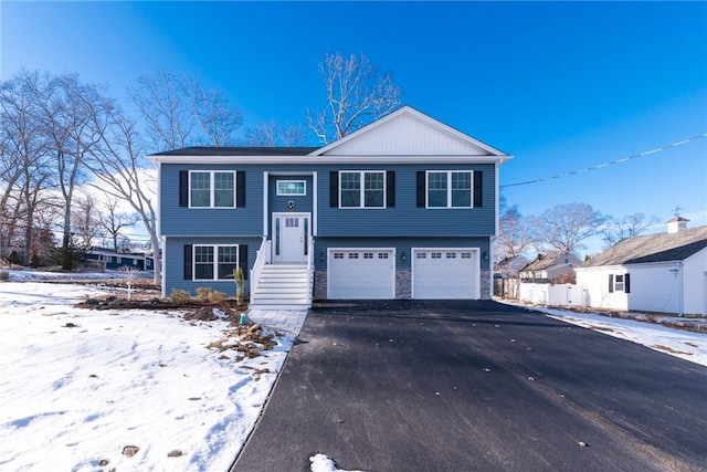 split foyer home featuring a garage