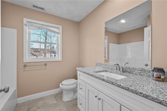 bathroom featuring tile patterned flooring, vanity, and toilet