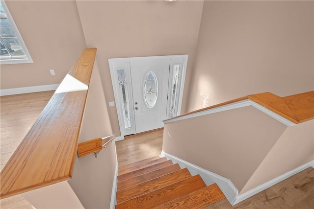 staircase featuring hardwood / wood-style flooring