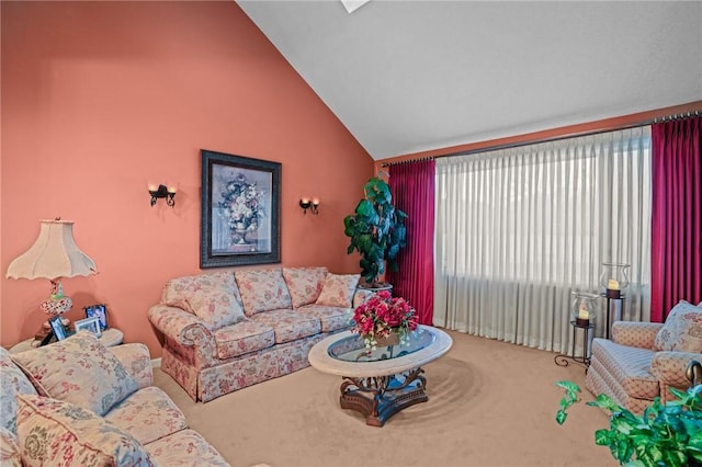 living room featuring vaulted ceiling and carpet floors