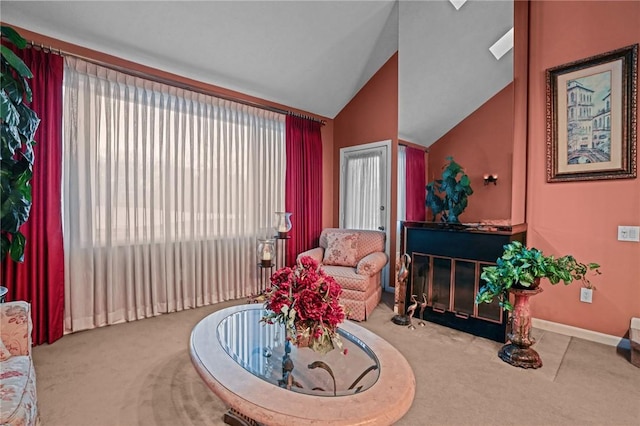 carpeted living room with vaulted ceiling