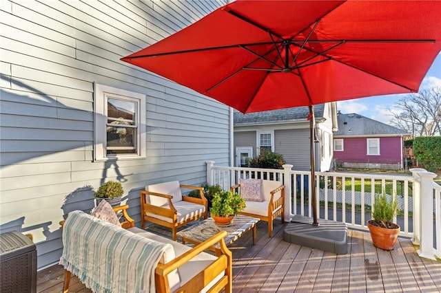 wooden terrace featuring an outdoor hangout area