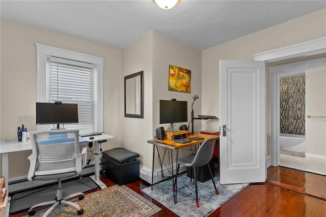 office area featuring a baseboard radiator and dark hardwood / wood-style floors