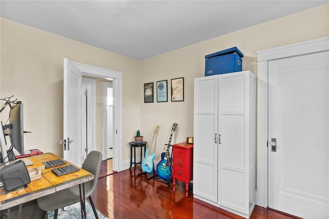 office space with dark hardwood / wood-style flooring