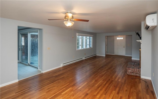 unfurnished living room featuring ceiling fan, hardwood / wood-style flooring, a wall mounted AC, and baseboard heating