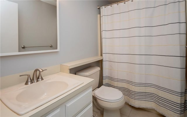 bathroom with vanity, tile patterned flooring, curtained shower, and toilet