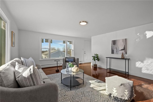 living room featuring hardwood / wood-style flooring and a baseboard heating unit