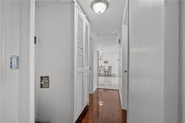 hallway with dark hardwood / wood-style flooring