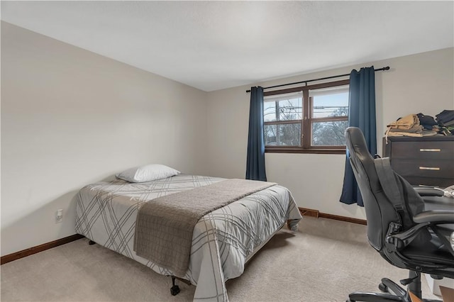 bedroom featuring light carpet