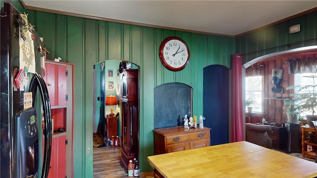 dining room featuring crown molding and hardwood / wood-style flooring