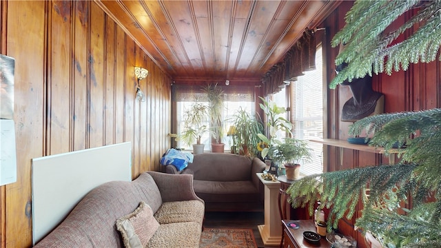 sitting room with wooden ceiling and wood walls