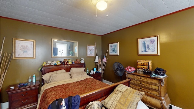 bedroom featuring crown molding