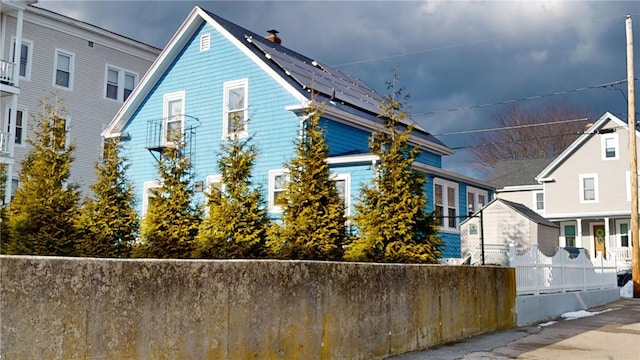 view of property exterior with solar panels