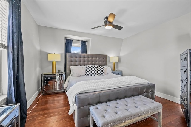 bedroom with ceiling fan and dark hardwood / wood-style flooring