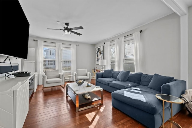 living room featuring dark hardwood / wood-style floors and ceiling fan