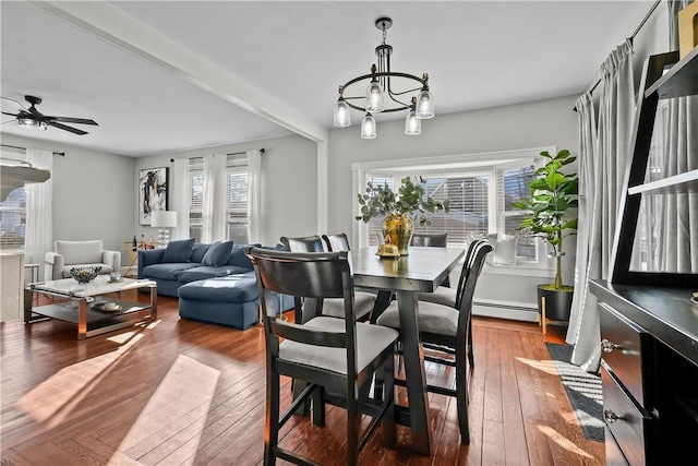 dining room with hardwood / wood-style floors, ceiling fan with notable chandelier, and a baseboard radiator