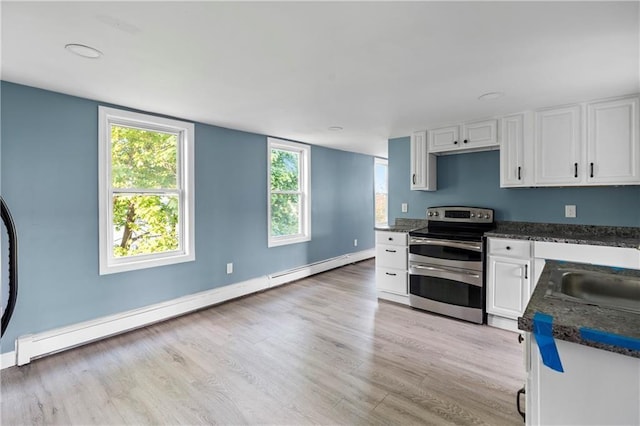 kitchen with a baseboard radiator, sink, white cabinets, range with two ovens, and light hardwood / wood-style flooring