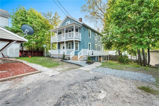 view of front of house with a balcony