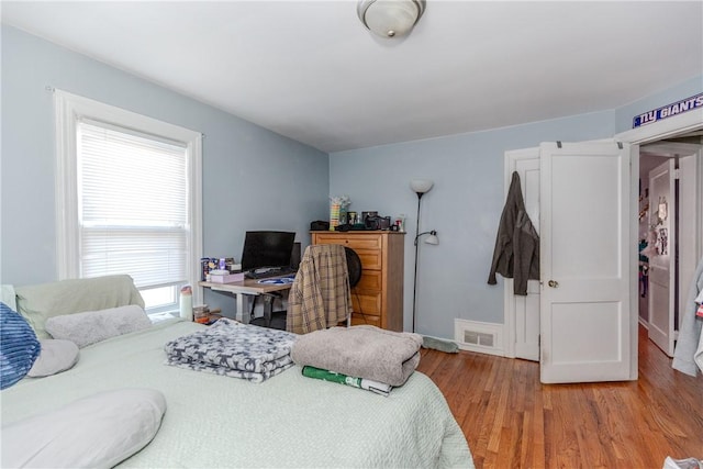 bedroom with light wood-type flooring