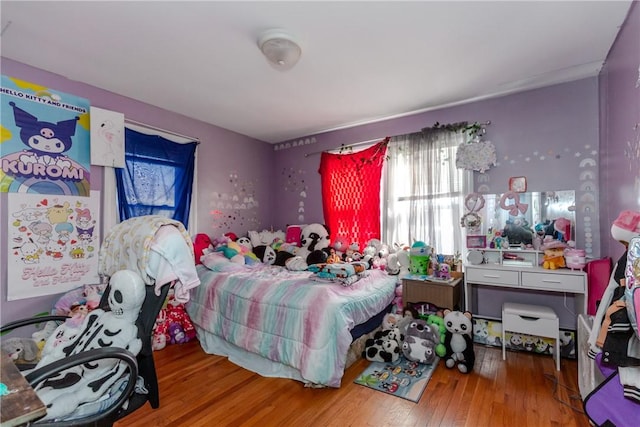 bedroom featuring hardwood / wood-style flooring