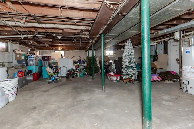 basement featuring water heater and electric panel