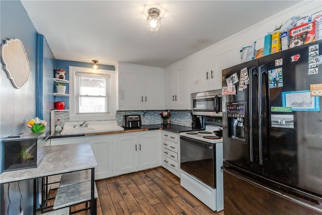 kitchen featuring white electric stove, backsplash, white cabinets, dark hardwood / wood-style flooring, and black fridge