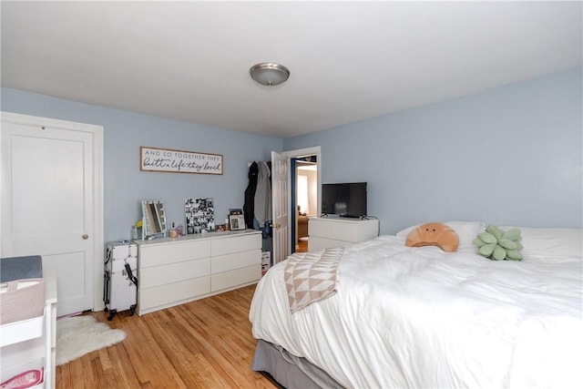 bedroom with light wood-type flooring