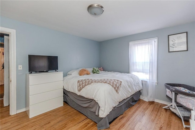 bedroom with light hardwood / wood-style flooring