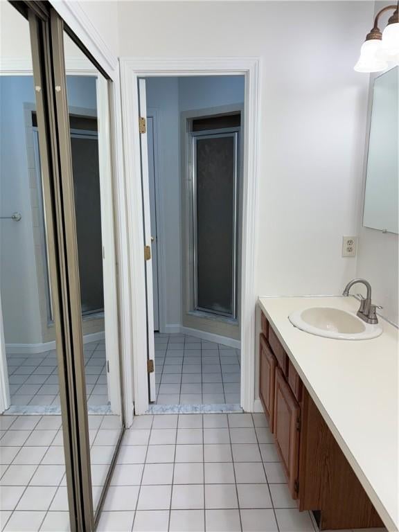 bathroom with vanity and tile patterned flooring