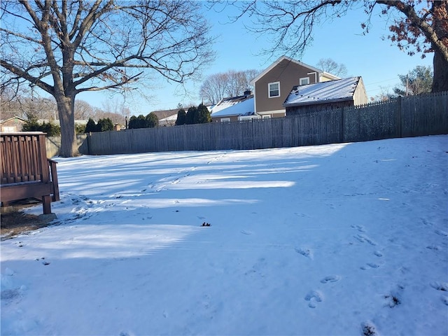 view of yard layered in snow