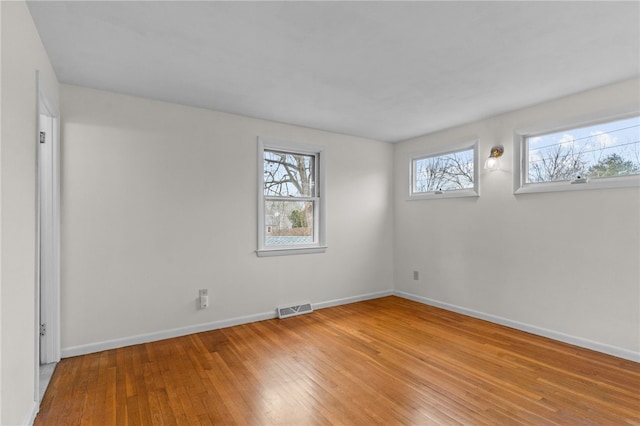 unfurnished room featuring light hardwood / wood-style flooring