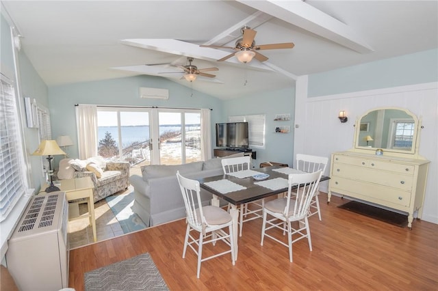 dining room with lofted ceiling, light hardwood / wood-style floors, and ceiling fan