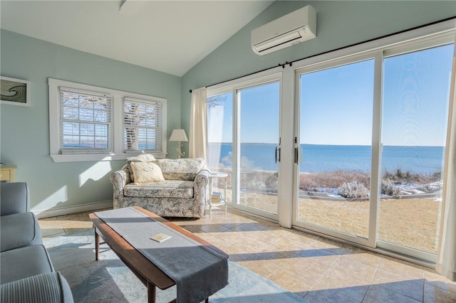 living room featuring a water view, lofted ceiling, light tile patterned flooring, and an AC wall unit