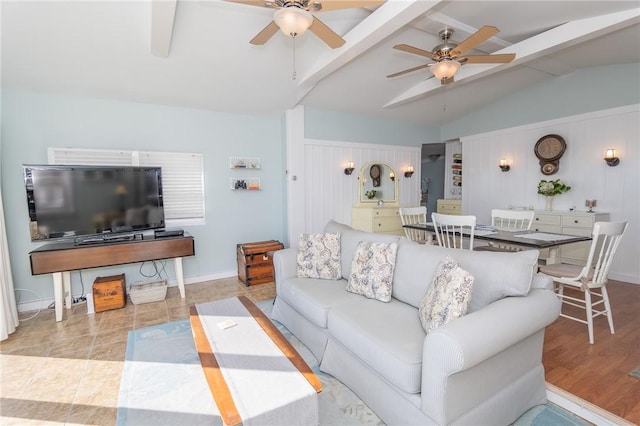 living room featuring lofted ceiling with beams and ceiling fan