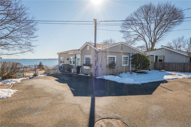 view of front of house with a water view