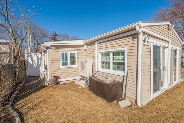 rear view of house featuring a yard