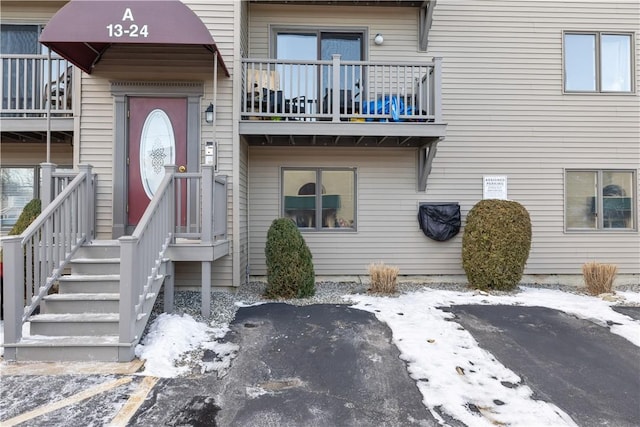 view of snow covered property entrance