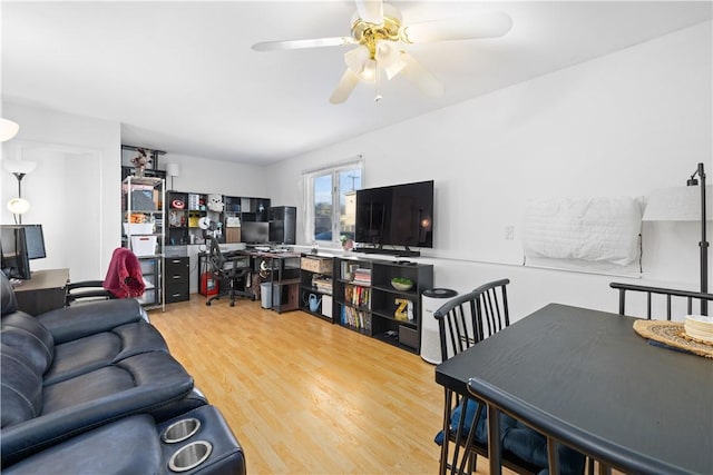 living room with hardwood / wood-style floors and ceiling fan