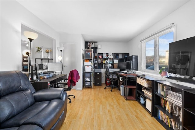 office with light wood-type flooring