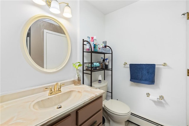 bathroom featuring vanity, a baseboard heating unit, and toilet