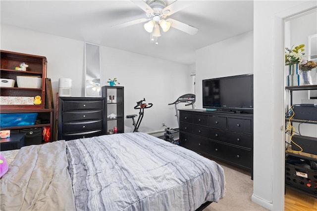 bedroom featuring light carpet and ceiling fan