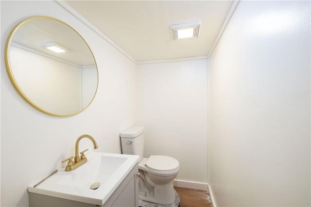 bathroom featuring sink, wood-type flooring, and toilet