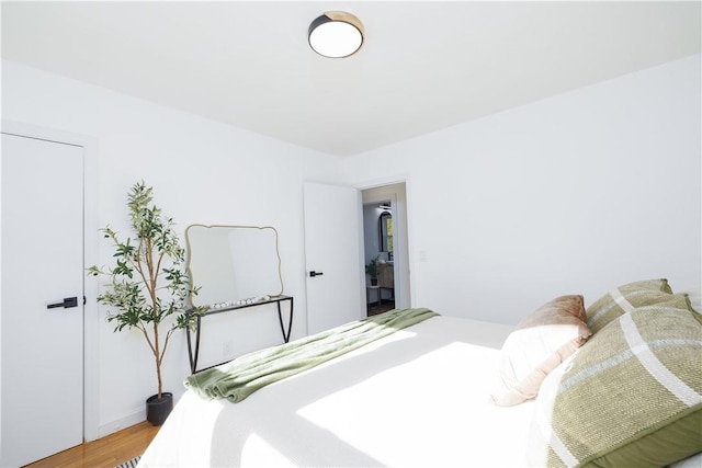 bedroom with wood-type flooring