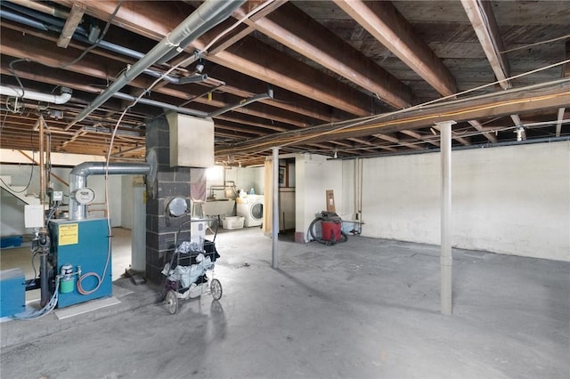 basement featuring sink and washer and dryer