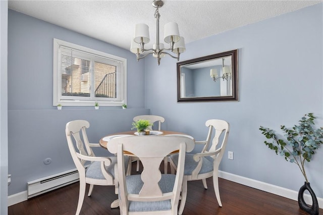 dining space with dark hardwood / wood-style flooring, a textured ceiling, a notable chandelier, and baseboard heating