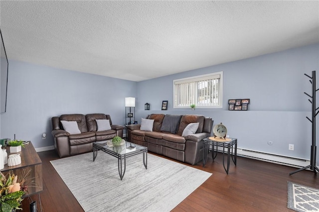 living room featuring dark hardwood / wood-style flooring, a textured ceiling, and baseboard heating