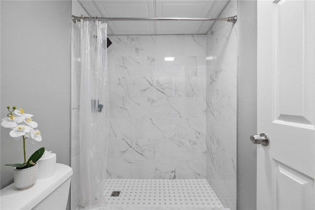 bathroom with toilet and walk in shower